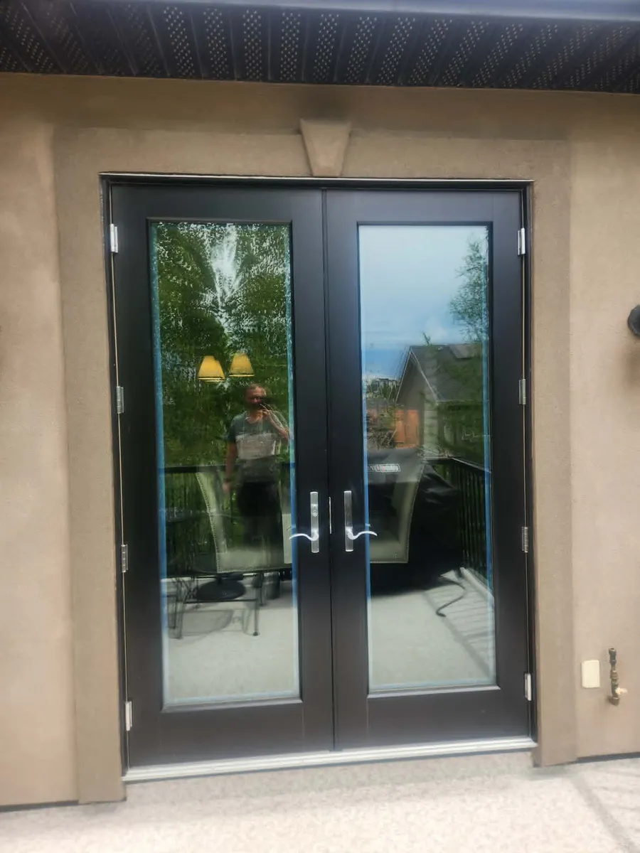 Balcony doors after stucco battons and crown moulding installed around them