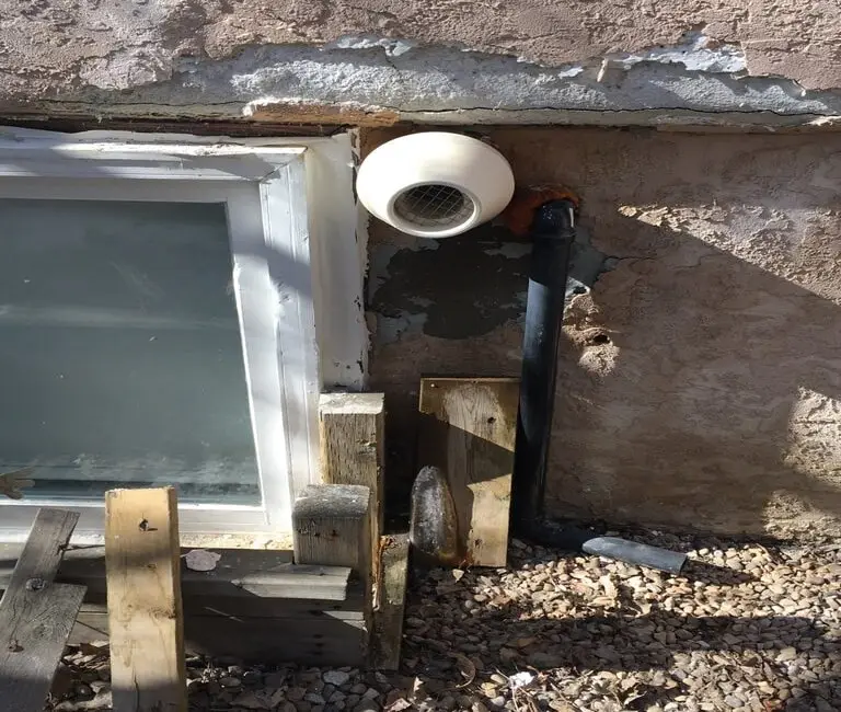 stucco damaged around the external house vent